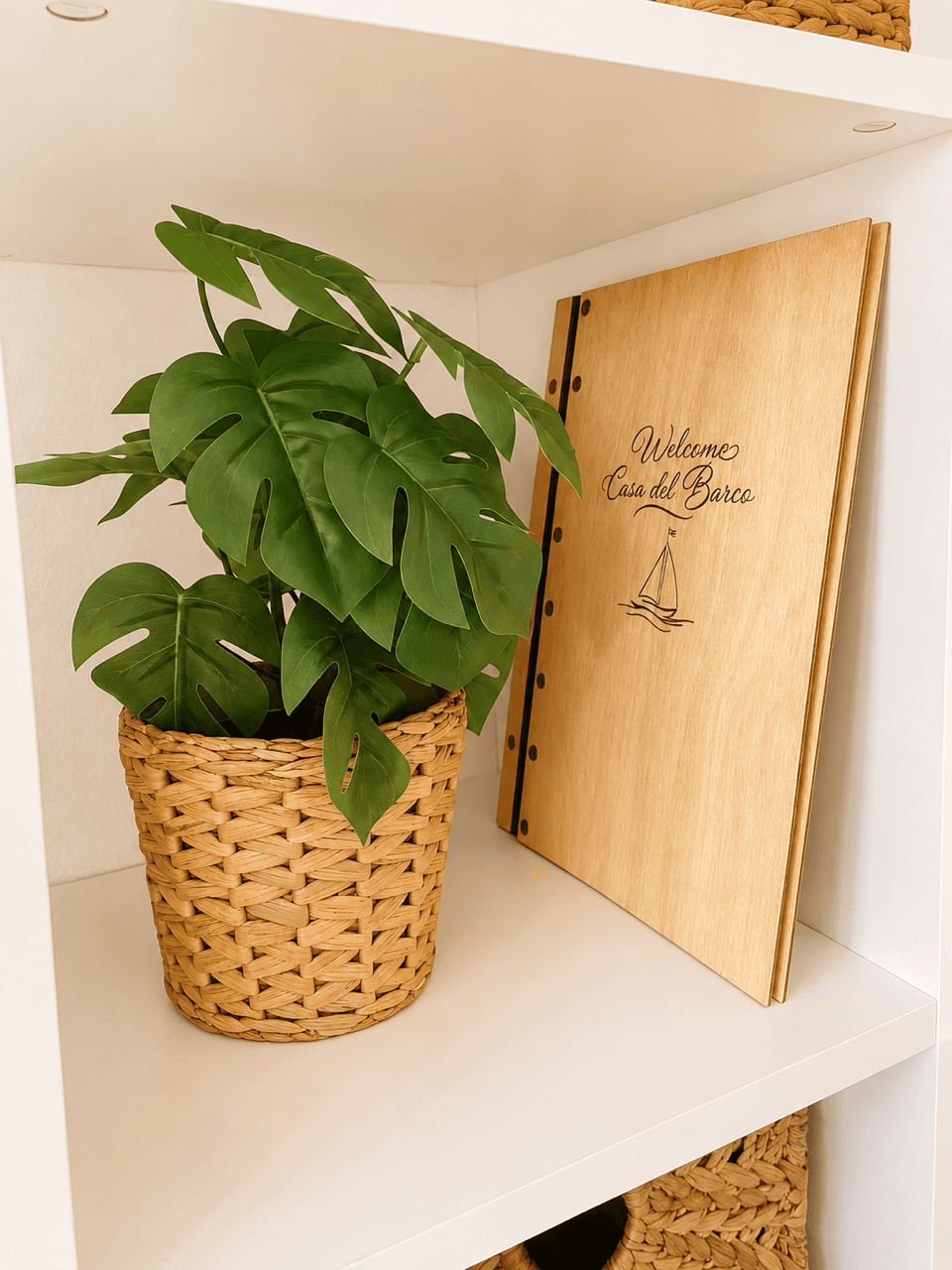 Plant in wicker basket next to welcome sign at Casa del Sol, Lanzarote.